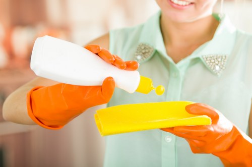 Team member following safe working practices during carpet cleaning