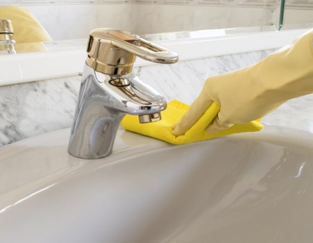 Professional upholstery cleaning equipment on furniture